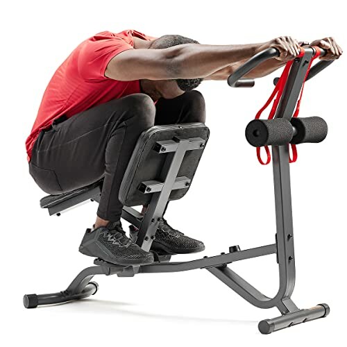 Man using an ab exercise machine