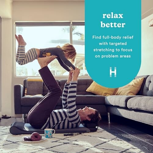 Father and child doing yoga together at home.