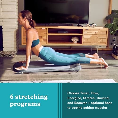 Woman performing a stretching exercise indoors on a yoga mat.