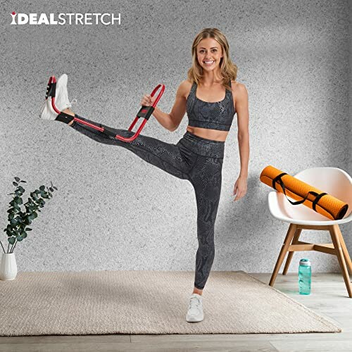 Woman stretching with exercise equipment in a room